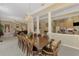 Formal dining room that has a large table and is adjacent to both the kitchen and living room at 95 Vic Edwards Rd, Sarasota, FL 34240