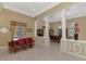 Elegant dining area with tile floors, decorative columns, and neutral color palette at 95 Vic Edwards Rd, Sarasota, FL 34240