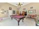 Entertain in this amazing game room with a pool table, bar, and cozy seating area, with an entertainment center at 95 Vic Edwards Rd, Sarasota, FL 34240