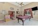 Entertain in this amazing game room with a pool table, bar, and cozy seating area at 95 Vic Edwards Rd, Sarasota, FL 34240