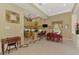 Bright open floor plan featuring a well-equipped kitchen with red dining set and tile flooring at 95 Vic Edwards Rd, Sarasota, FL 34240