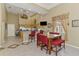 Bright kitchen with barstool seating, stainless steel appliances, and granite countertops at 95 Vic Edwards Rd, Sarasota, FL 34240