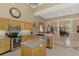 Open-concept kitchen with stainless appliances, granite countertops, and decorative tile floors at 95 Vic Edwards Rd, Sarasota, FL 34240