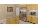 The kitchen is equipped with stainless steel appliances and a granite-topped island at 95 Vic Edwards Rd, Sarasota, FL 34240
