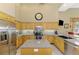 Bright kitchen with stainless appliances, granite countertops, and ample cabinet space at 95 Vic Edwards Rd, Sarasota, FL 34240