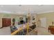 Spacious living room featuring a fireplace, large windows, and chandeliers, creating an inviting atmosphere at 95 Vic Edwards Rd, Sarasota, FL 34240