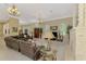 Spacious living room with tile flooring, high ceilings, a decorative fireplace, and large windows for natural light at 95 Vic Edwards Rd, Sarasota, FL 34240