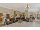 Spacious open living area with a leather sofa and easy access to dining and stairwell at 95 Vic Edwards Rd, Sarasota, FL 34240