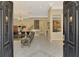 Elegant living room with tile flooring, chandelier, and open floor plan showcasing the home's interior at 95 Vic Edwards Rd, Sarasota, FL 34240