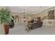 Open-concept living room with high ceilings, decorative fireplace, chandelier, and tile flooring at 95 Vic Edwards Rd, Sarasota, FL 34240