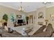 Comfortable living room featuring tile floors, a cozy fireplace, and ample natural light at 95 Vic Edwards Rd, Sarasota, FL 34240