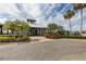 The community clubhouse with lush landscaping provides a central hub for activities and social gatherings at 1030 Tidewater Shores Loop # 404, Bradenton, FL 34208