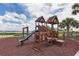 Community playground with play structures, slide, and swings, is great for families with children at 1030 Tidewater Shores Loop # 404, Bradenton, FL 34208