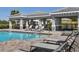 Resort style pool with tanning deck and cabana perfect for enjoying the Florida sun at 1030 Tidewater Shores Loop # 404, Bradenton, FL 34208