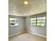 Well lit bedroom with lots of natural light and neutral flooring at 1220 12Th W Ave, Palmetto, FL 34221