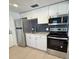 Modern kitchen with stainless steel appliances, white cabinetry, and beautiful subway backsplash at 1220 12Th W Ave, Palmetto, FL 34221