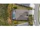Aerial view shows the roof of the home and the backyard screened-in pool at 12715 Wheatgrass Ct, Parrish, FL 34219