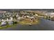 Aerial view of a community with a pool, playground, lake and basketball court for active outdoor living and leisure at 12715 Wheatgrass Ct, Parrish, FL 34219