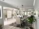 Dining room with decorative rug and stylish table, open to other living areas at 12715 Wheatgrass Ct, Parrish, FL 34219