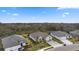 Beautiful single-Gathering home has a three-car garage, paver driveway, and lush landscaping at 12715 Wheatgrass Ct, Parrish, FL 34219