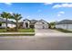 Beautiful single-Gathering home with lush landscaping and a three-car garage at 12715 Wheatgrass Ct, Parrish, FL 34219