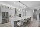 Well-lit kitchen with stainless steel appliances, a long island, and modern pendant lighting at 12715 Wheatgrass Ct, Parrish, FL 34219