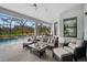 Relaxing screened lanai with plush seating and views of the pool and greenery at 12715 Wheatgrass Ct, Parrish, FL 34219