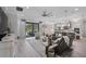 Spacious living room with access to kitchen and an outdoor entertainment area at 12715 Wheatgrass Ct, Parrish, FL 34219