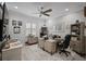 Office with 2 desks, ceiling fan, plush carpet, and modern decor at 12715 Wheatgrass Ct, Parrish, FL 34219