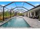 Stunning pool with screened enclosure and ample patio space for entertaining at 12715 Wheatgrass Ct, Parrish, FL 34219