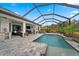 Enjoy the Florida lifestyle with this backyard oasis featuring a pool and outdoor seating at 12715 Wheatgrass Ct, Parrish, FL 34219