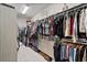 Spacious walk-in closet with custom shelving and ample storage space at 12715 Wheatgrass Ct, Parrish, FL 34219