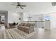 Upstairs living room features a ceiling fan, a table and chairs, a couch, and views of the neighborhood at 13721 Saw Palm Creek Trl, Lakewood Ranch, FL 34211