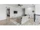 Upstairs loft area with cozy seating, television, and dedicated workspace at 13721 Saw Palm Creek Trl, Lakewood Ranch, FL 34211