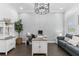 Stylish home office with desk, comfortable seating, and ample storage, perfect for remote work at 13721 Saw Palm Creek Trl, Lakewood Ranch, FL 34211