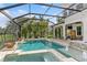 Backyard pool with water features, screened in for pest control, with outdoor seating and view of the yard at 13721 Saw Palm Creek Trl, Lakewood Ranch, FL 34211