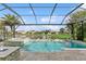 Screened pool boasts a spa and water feature, providing a tranquil oasis overlooking the water at 13721 Saw Palm Creek Trl, Lakewood Ranch, FL 34211