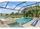 Relaxing screened pool and spa with fire feature and lush landscaping create an inviting outdoor space at 13721 Saw Palm Creek Trl, Lakewood Ranch, FL 34211