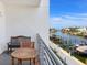 Inviting balcony seating area overlooking a picturesque canal with boat docks at 1709 N Tamiami Trl # 318, Sarasota, FL 34234