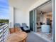Private balcony with seating offering outdoor views and fresh air at 1709 N Tamiami Trl # 318, Sarasota, FL 34234