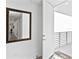 Bright entryway with a large decorative mirror and view of the outdoor balcony at 1709 N Tamiami Trl # 318, Sarasota, FL 34234