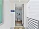 Welcoming entryway featuring a modern shelving unit with decorative vases, and a view into the home at 1709 N Tamiami Trl # 318, Sarasota, FL 34234