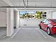 Parking garage view showcasing assigned parking space and nearby building at 1709 N Tamiami Trl # 318, Sarasota, FL 34234
