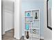 Hallway with a decorative display shelf and views of the closet at 1709 N Tamiami Trl # 318, Sarasota, FL 34234