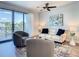 Cozy living room with comfortable seating, modern decor, and access to a private balcony at 1709 N Tamiami Trl # 318, Sarasota, FL 34234