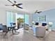 Modern living room with a dining area, comfortable seating, and a balcony with scenic views at 1709 N Tamiami Trl # 318, Sarasota, FL 34234