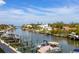 Scenic waterfront view showing boat docks on a canal with blue skies and other homes in the background at 1709 N Tamiami Trl # 318, Sarasota, FL 34234