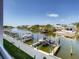Beautiful view of a waterfront canal with boat docks and luxury homes, providing serene outdoor living at 1709 N Tamiami Trl # 318, Sarasota, FL 34234