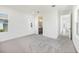 An airy bedroom with natural light, soft carpet, and open doorway leading to the ensuite at 172 Eagleston Ln, Sarasota, FL 34240
