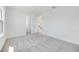 Large bedroom featuring a walk in closet, soft grey carpet, and natural light at 172 Eagleston Ln, Sarasota, FL 34240